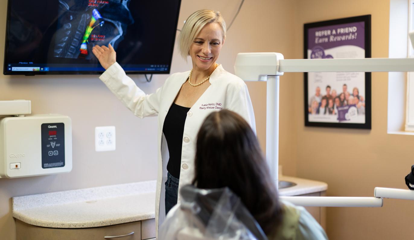 Dr. Weitz showing a patient an x-ray.